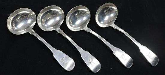 A set of four George IV provincial silver fiddle pattern sauce ladles by John Walton, 7.5 oz.